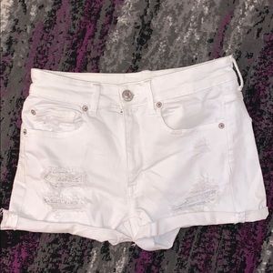 White ripped shorts